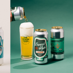 Wide banner featuring multiple Foam Brewers beer cans with colorful die-cut labels next to poured beer glasses, highlighting premium label quality and shelf appeal