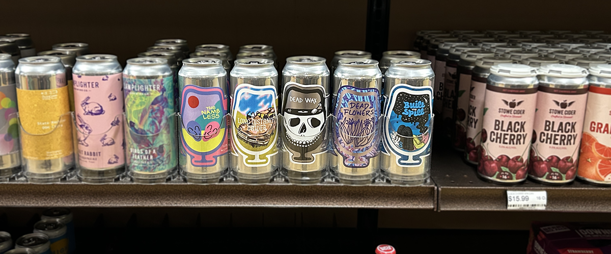 Foam Brewers craft beer cans displayed on retail shelf showcasing colorful custom die-cut labels and strong shelf appeal